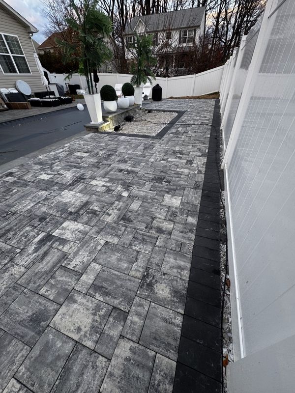 Side-yard paver walkway built on a compacted base